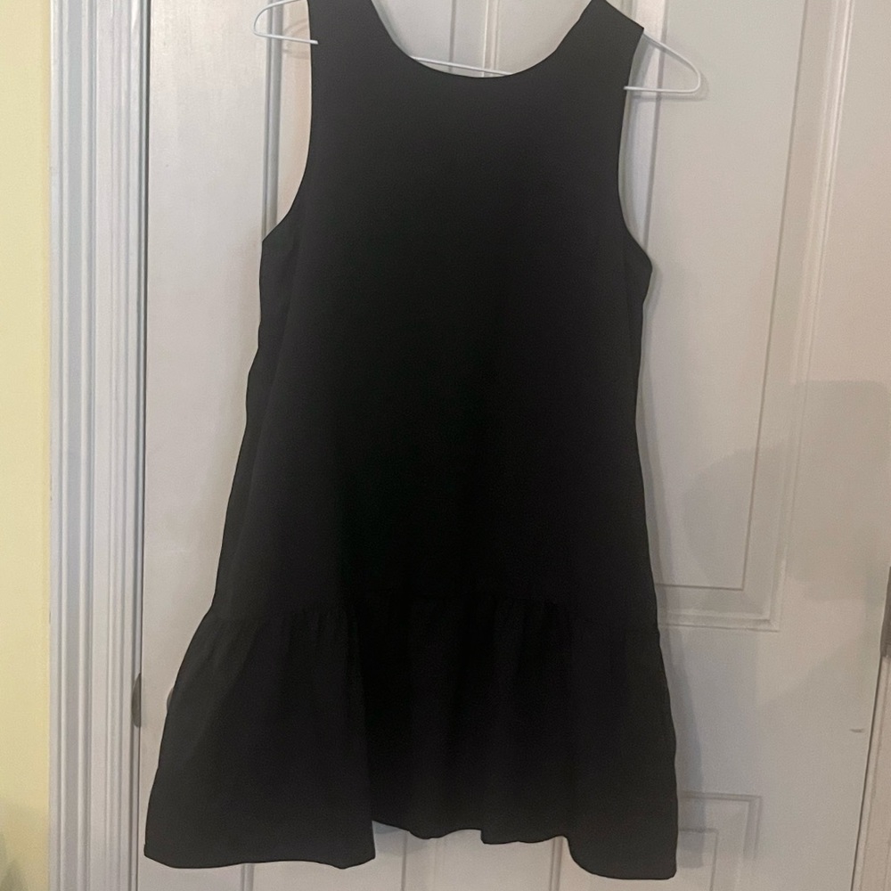 TCEC little black sleeveless woman’s dress with bottom flare size small.